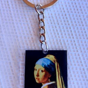 Llavero  en resina de pintura la mujer de la perla